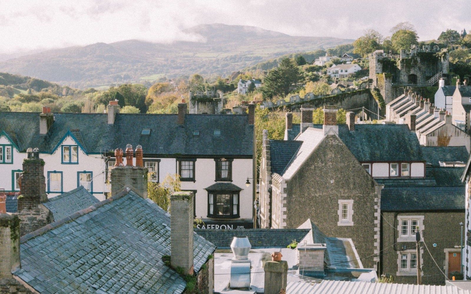 Slate rooftops of a British market town under a wide sky
