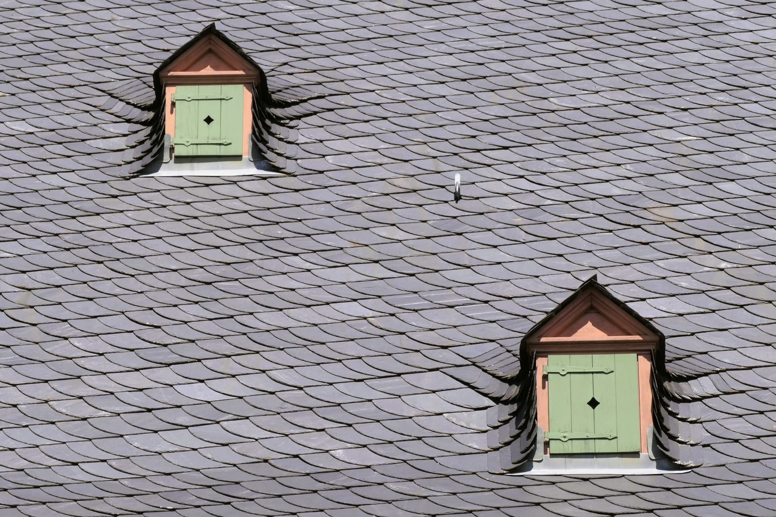 Traditional slate roof with dormer windows